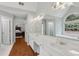 Primary bathroom features an expansive vanity, soaking tub, and glass enclosed shower at 2009 Mclain Nw Rd, Acworth, GA 30101