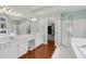 Primary bathroom features an expansive vanity, soaking tub, and glass enclosed shower at 2009 Mclain Nw Rd, Acworth, GA 30101