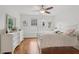 Bedroom with natural light, hardwood floors, white dresser, and a double bed at 2009 Mclain Nw Rd, Acworth, GA 30101