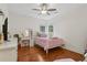 Cozy bedroom with hardwood floors, natural light, vanity, and a comfortable bed at 2009 Mclain Nw Rd, Acworth, GA 30101
