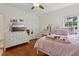 Bedroom with vanity, hardwood floors and light pink comforter set at 2009 Mclain Nw Rd, Acworth, GA 30101