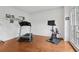 Exercise room with hardwood floors, treadmill, and stationary bike at 2009 Mclain Nw Rd, Acworth, GA 30101