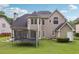 A well maintained large backyard featuring a lush lawn and mature trees offers plenty of room at 2009 Mclain Nw Rd, Acworth, GA 30101