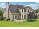 Charming home featuring a well-maintained lawn, patio and backyard, perfect for outdoor enjoyment at 2009 Mclain Nw Rd, Acworth, GA 30101