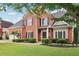 Beautiful brick home with a well-maintained lawn, black shutters, and manicured bushes offering great curb appeal at 2009 Mclain Nw Rd, Acworth, GA 30101