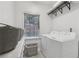 Bright laundry room with white appliances and ample storage at 2009 Mclain Nw Rd, Acworth, GA 30101