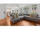 Open living space with hardwood floors, a large gray sectional, and natural light, perfect for gatherings at 2009 Mclain Nw Rd, Acworth, GA 30101