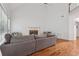 Comfortable living room with hardwood floors, a fireplace, and a large sectional sofa for relaxing and entertaining at 2009 Mclain Nw Rd, Acworth, GA 30101