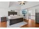 Primary bedroom with a view to the landing has a ceiling fan and wall-mounted television at 2009 Mclain Nw Rd, Acworth, GA 30101