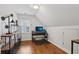Attic office with a desk and shelves, showcasing a practical workspace at 2009 Mclain Nw Rd, Acworth, GA 30101