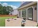 Back patio with flower beds and a fence; a cozy spot for outdoor relaxation and entertaining at 2009 Mclain Nw Rd, Acworth, GA 30101