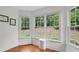 A sitting area in the primary bedroom has three windows with beautiful natural light at 2009 Mclain Nw Rd, Acworth, GA 30101