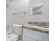 Bathroom features granite countertops, tiled shower, and white cabinets at 2721 Glenvalley Dr, Decatur, GA 30032