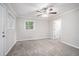 Bedroom with plush carpeting, a ceiling fan, and natural light at 2721 Glenvalley Dr, Decatur, GA 30032