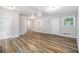 Open living room with wood-look flooring and plenty of natural light at 2721 Glenvalley Dr, Decatur, GA 30032
