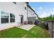 Backyard with concrete patio, small garden and privacy fence at 320 Crider Ct, Woodstock, GA 30188