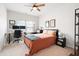 Cozy bedroom with a comfortable bed, desk and a ceiling fan at 320 Crider Ct, Woodstock, GA 30188