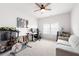 Versatile bedroom featuring a ceiling fan, natural light, and space for a home office or gym at 320 Crider Ct, Woodstock, GA 30188