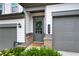 A well-decorated front door with wreath, number 320 and an Atlanta Braves door flag at 320 Crider Ct, Woodstock, GA 30188