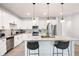 Bright kitchen featuring granite countertops, stainless steel appliances and a large island at 320 Crider Ct, Woodstock, GA 30188