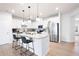 Modern kitchen with stainless steel appliances, granite countertops, and a large island at 320 Crider Ct, Woodstock, GA 30188