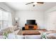 Relaxing living room with large windows, modern decor, and comfortable seating at 320 Crider Ct, Woodstock, GA 30188