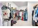 Spacious walk-in closet providing ample storage with organized shelving and hanging space at 320 Crider Ct, Woodstock, GA 30188