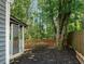 The fenced backyard and screened-in porch create a relaxing outdoor living space at 4679 Candlewyck Way, Buford, GA 30518