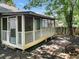 Covered back porch and fenced yard in a private and shaded setting at 4679 Candlewyck Way, Buford, GA 30518