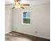 Bedroom featuring window and hardwood floors at 4679 Candlewyck Way, Buford, GA 30518