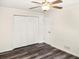 Bedroom features ceiling fan, closet, and hardwood floors at 4679 Candlewyck Way, Buford, GA 30518