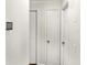 Hallway with white doors and modern thermostat at 4679 Candlewyck Way, Buford, GA 30518
