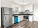 Bright kitchen featuring white cabinetry, stainless steel appliances, and a unique backsplash; style and function in perfect harmony at 4679 Candlewyck Way, Buford, GA 30518