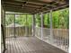 Relax on this screened porch with wood floors and view of fenced backyard at 4679 Candlewyck Way, Buford, GA 30518