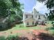 Spacious backyard with a patio, fence, and lush greenery, perfect for outdoor activities and relaxation at 49 Hampton Dr, Cartersville, GA 30121