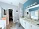 This bathroom features double sinks, a separate shower and bathtub, and entry to a walk-in closet at 49 Hampton Dr, Cartersville, GA 30121