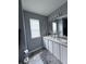 Bathroom features double sinks, neutral walls and floors, and a large mirror at 49 Hampton Dr, Cartersville, GA 30121