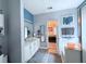 A bathroom boasting double sinks, a soaking tub and separate shower with a view to the main bedroom at 49 Hampton Dr, Cartersville, GA 30121