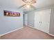 Comfortable bedroom featuring a ceiling fan, a closet, and a pleasant decorative picture at 49 Hampton Dr, Cartersville, GA 30121