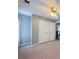 Bedroom with a ceiling fan, neutral walls and carpet, and a large closet near the entry at 49 Hampton Dr, Cartersville, GA 30121