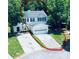 Charming two-story home with a two-car garage, spacious driveway, and well-maintained landscaping at 49 Hampton Dr, Cartersville, GA 30121