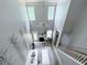 Bright living room features soaring ceilings, a cozy fireplace, and staircase at 49 Hampton Dr, Cartersville, GA 30121