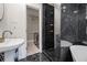 Modern bathroom featuring a black marble shower, a vessel sink, and sleek fixtures at 1151 Bromley Rd, Avondale Estates, GA 30002