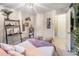 Cozy bedroom showcasing a comfortable bed and decorative shelving at 1151 Bromley Rd, Avondale Estates, GA 30002