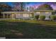 Charming brick home with a well-manicured lawn and covered parking area at 1151 Bromley Rd, Avondale Estates, GA 30002