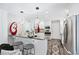 Bright kitchen with stainless steel appliances, breakfast bar, and modern pendant lighting at 1151 Bromley Rd, Avondale Estates, GA 30002