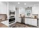 Updated kitchen with white cabinets, stainless steel appliances, and modern countertops at 1151 Bromley Rd, Avondale Estates, GA 30002