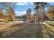 Picturesque lake view with autumn trees and community gazebo in the background at 1151 Bromley Rd, Avondale Estates, GA 30002