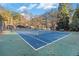 A meticulously maintained tennis court ready for play, set within the Avondale Estates Swim & Tennis Club at 1151 Bromley Rd, Avondale Estates, GA 30002