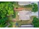 Aerial view of a home with a large backyard, driveway, and surrounding trees at 2030 Beyers Landing Dr, Buford, GA 30519
